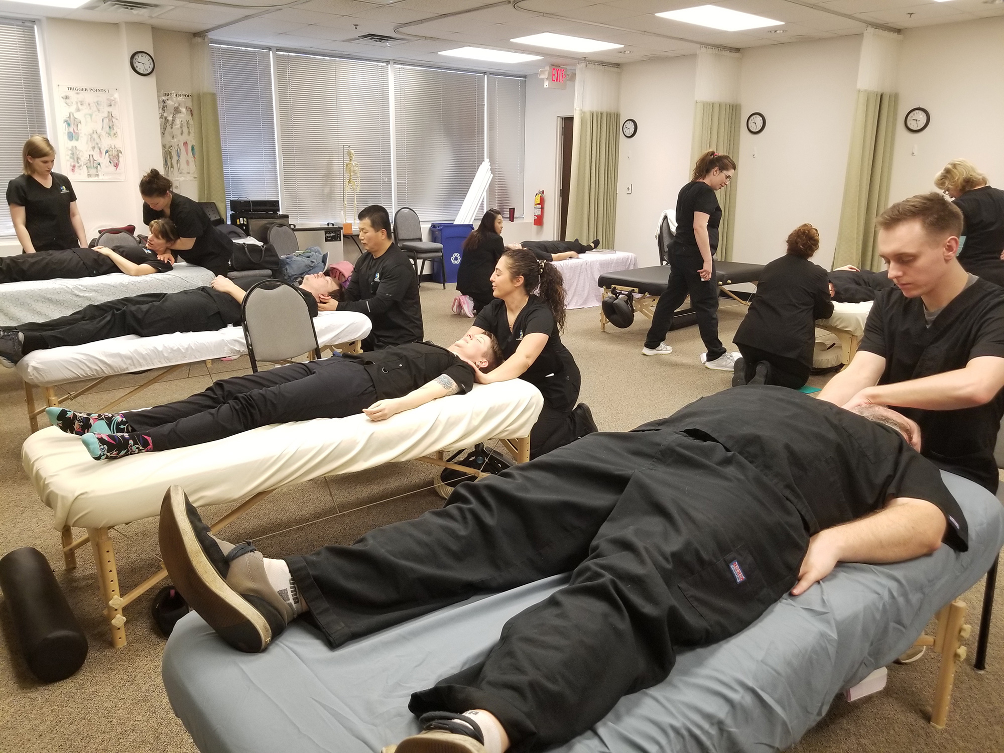 Group of students practicing massages