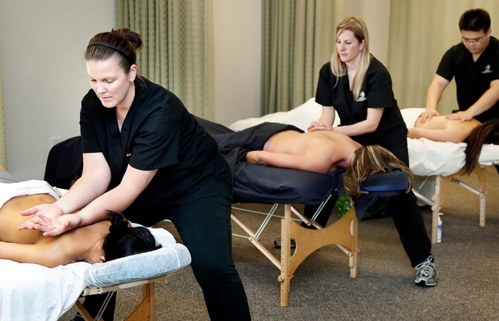 Masseuses giving a massage.