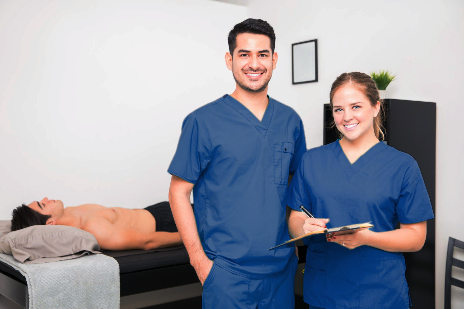 Male and Female Licensed Massage Therapists at Work